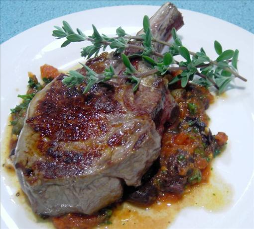 Veal cutlets with olive, tomato and anchovy sauce. Photo by JustJanS