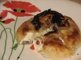 Brie En Croute Stuffed with Olives & Roasted Peppers