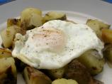 Potato and onion hash with a fried egg (for one)