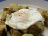 Potato and onion hash with a fried egg (for one). Recipe by Hey Jude